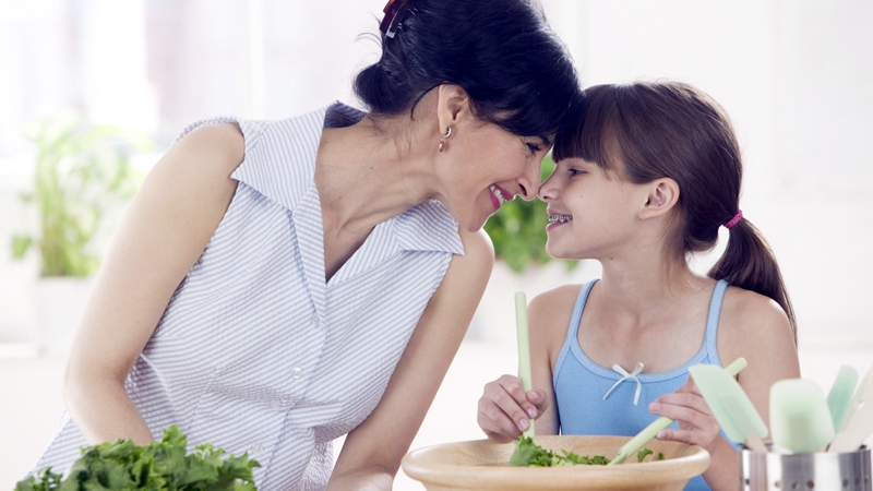 Mother and Daughter Making a Salad