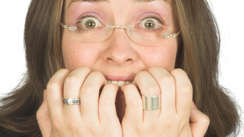 business woman biting her nails