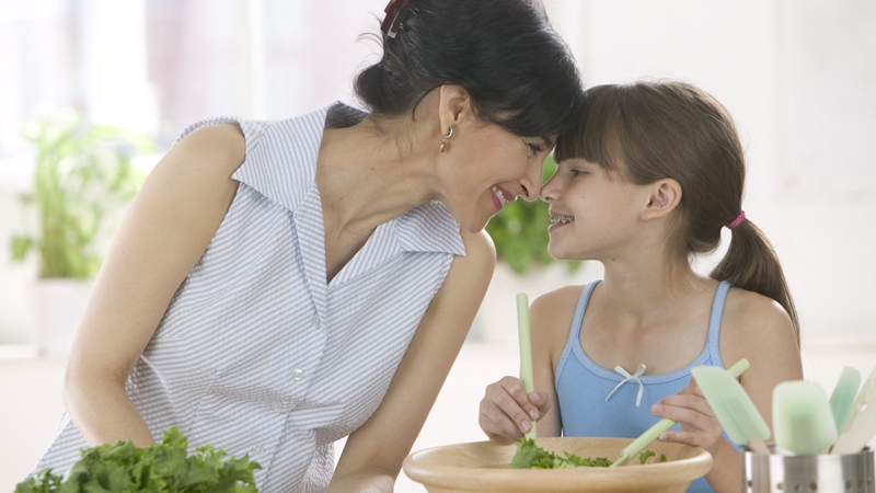 Mother and Daughter Making a Salad